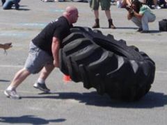 Mike Pelosi flipping a tyre