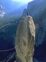 Climber on top of the Lost Arrow, Yosemite. Photo &copy; Guillaume Dargaud.